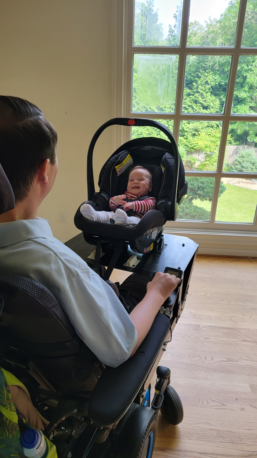 A man looks at his baby